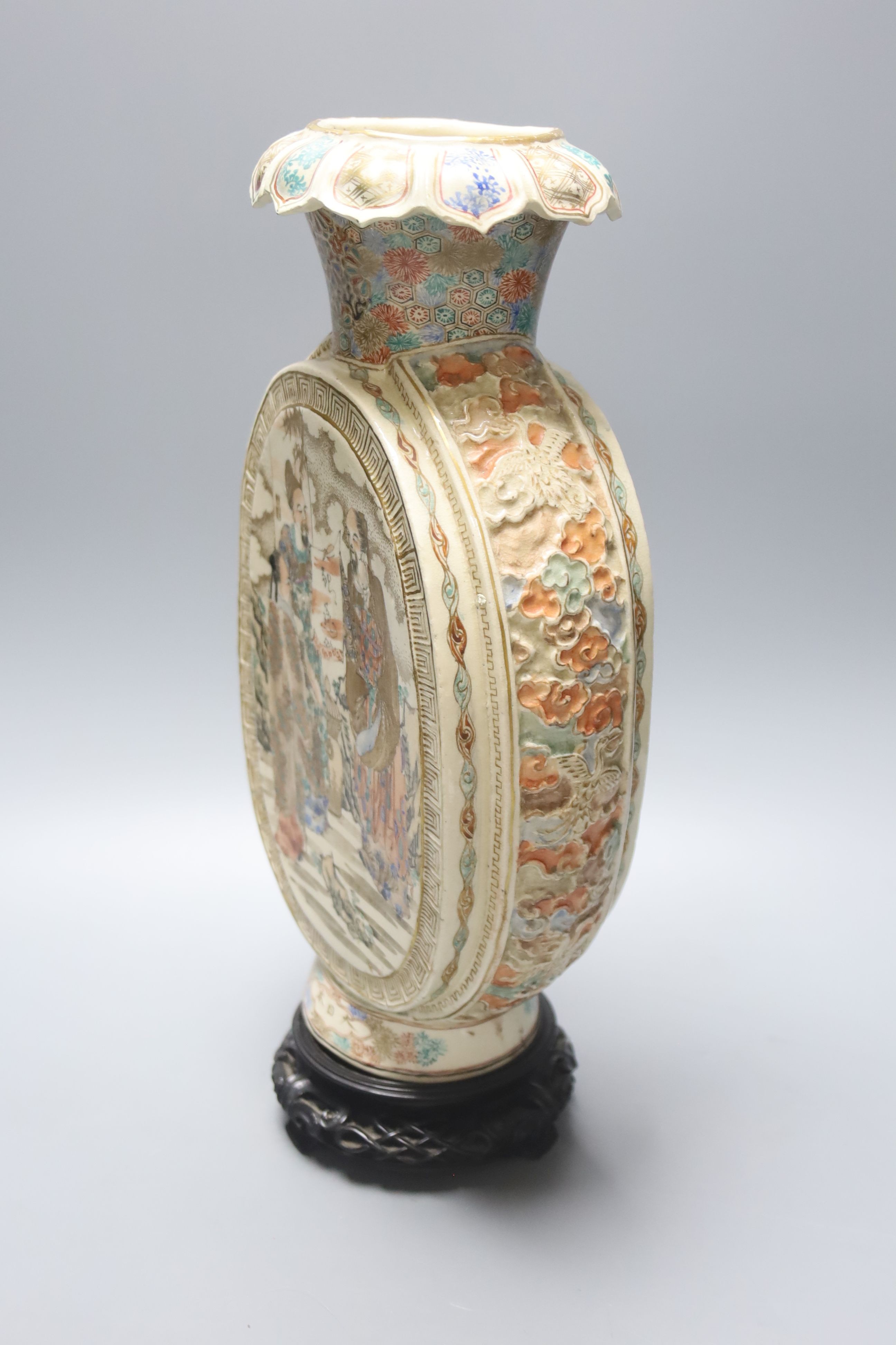 A large Japanese Satsuma pottery flask shaped vase, Meiji period, six character mark around the foot, 34cm, wood stand